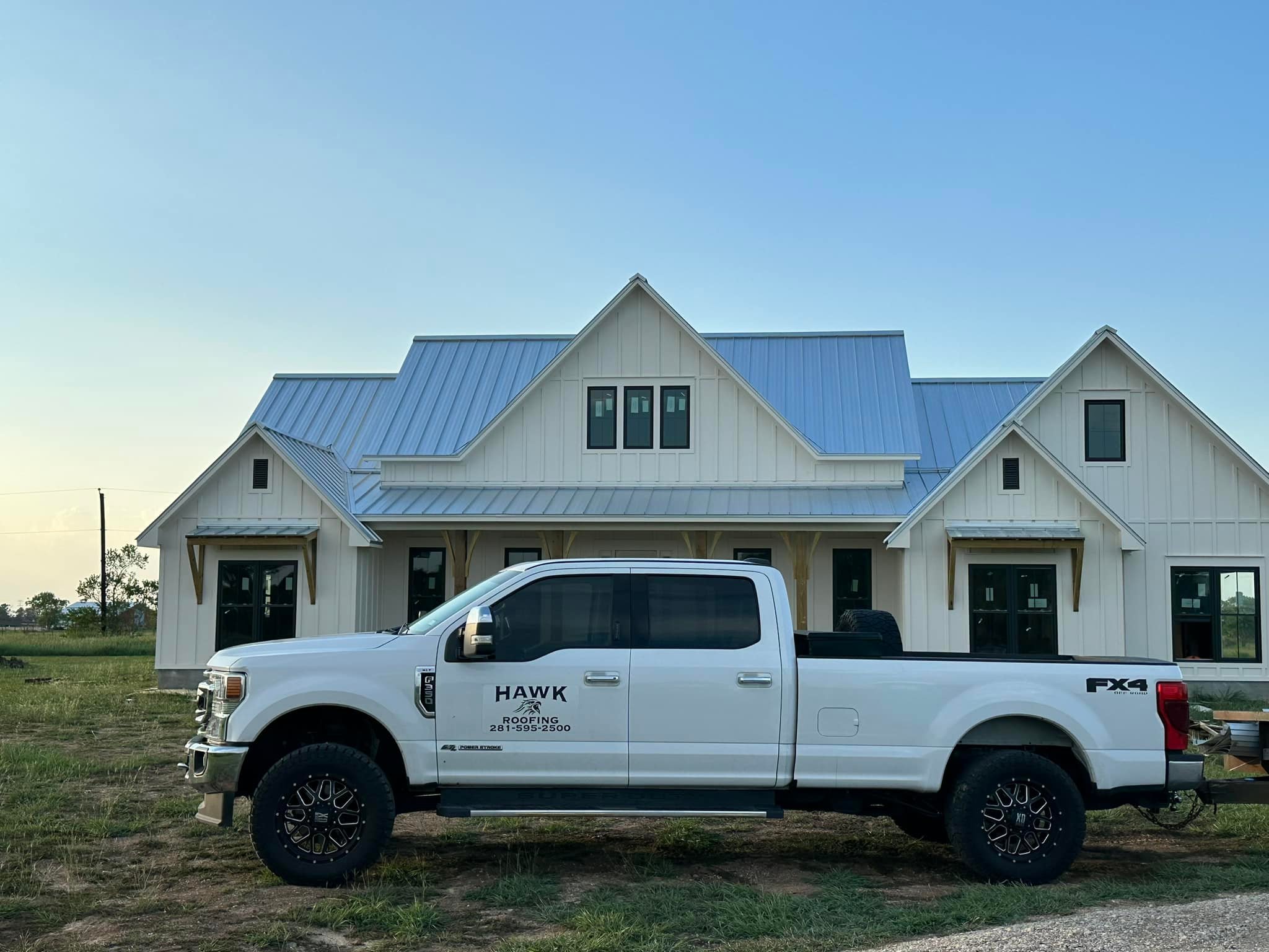 Hawk Roofing Vehicle Parked in Front of Home.